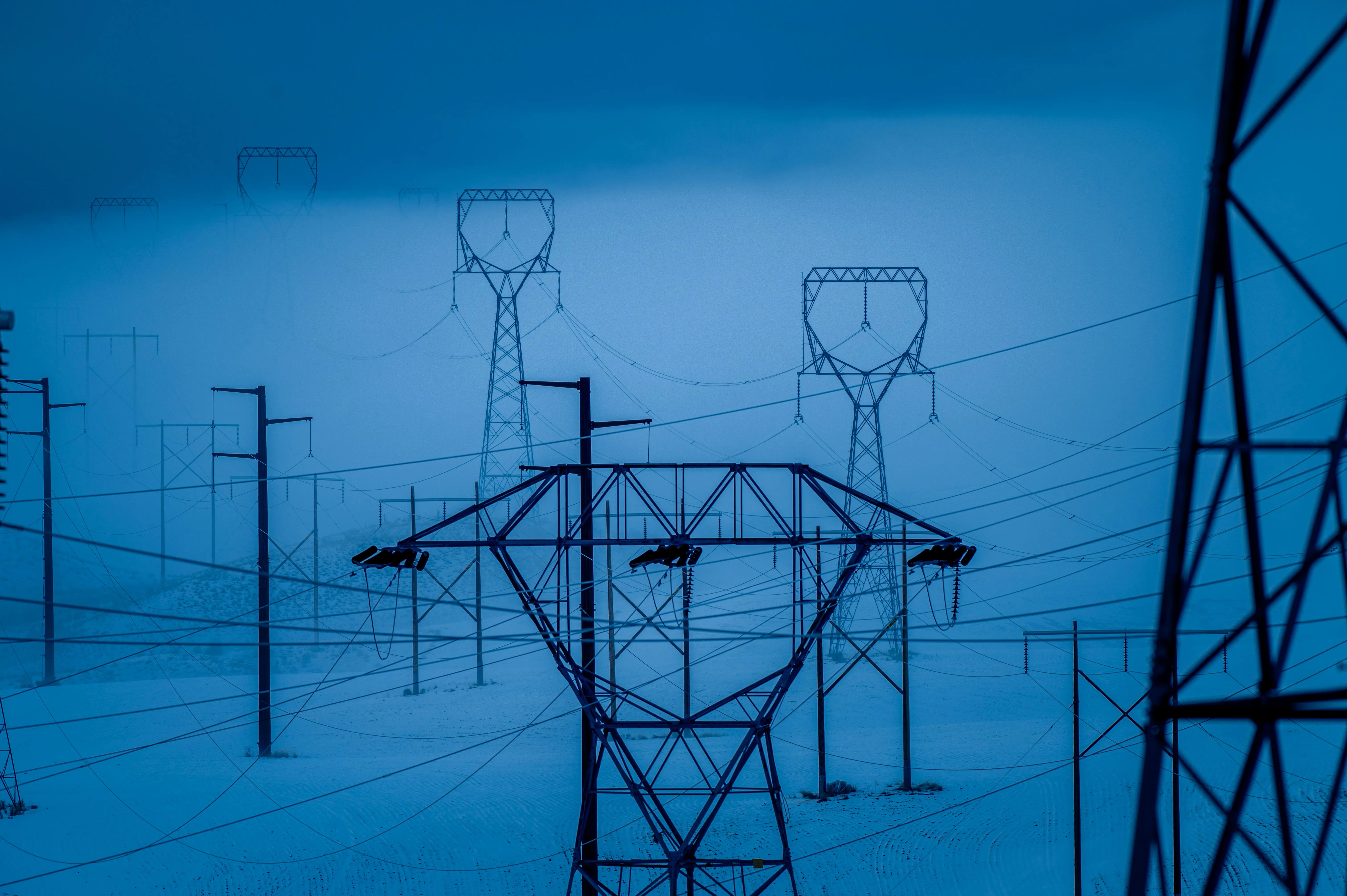 Outdoor NEMA-rated electrical enclosures and pad-mounted power distribution equipment at dusk