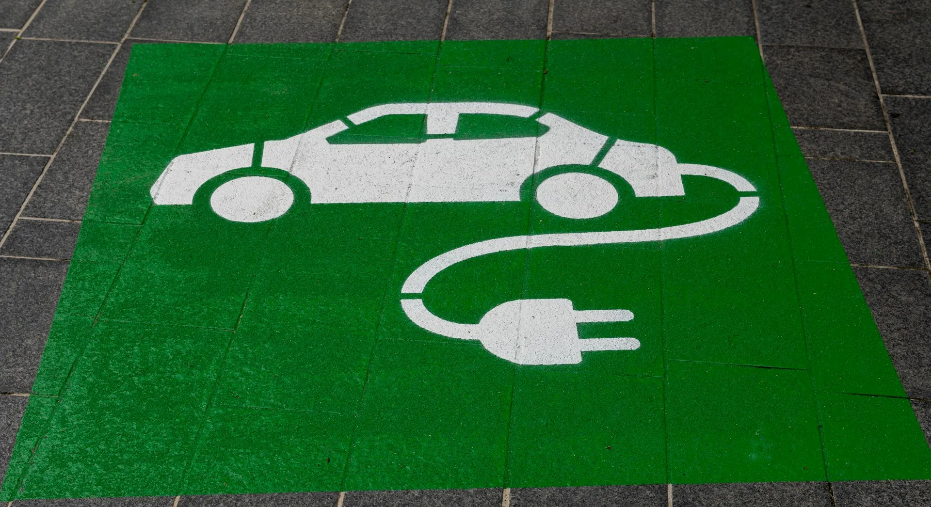Public EV fast-charging station with a grid connection, illustrating EV charging load management and site power planning