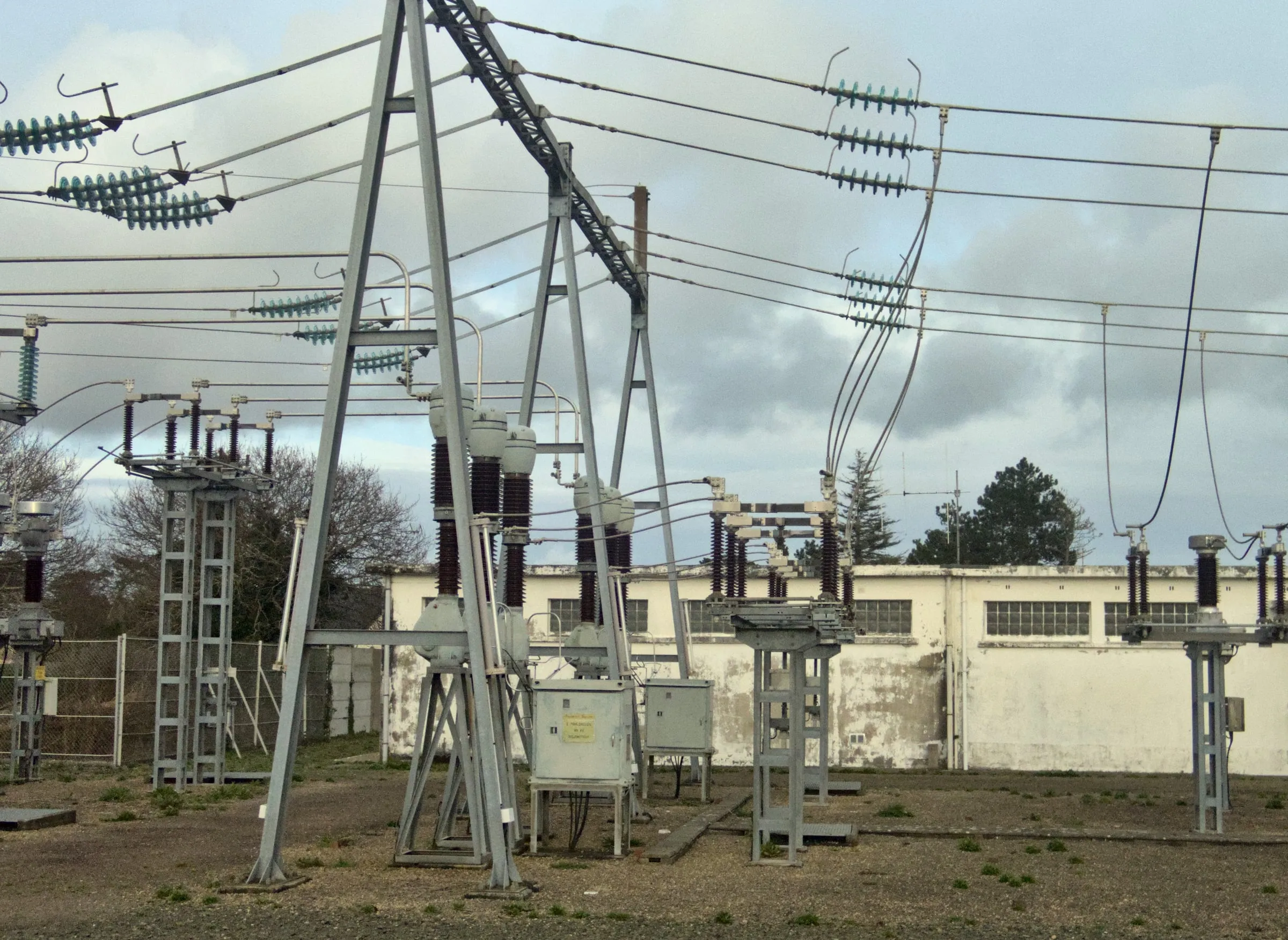 Medium-voltage transformer and switchgear at an industrial substation where the system grounding scheme is set