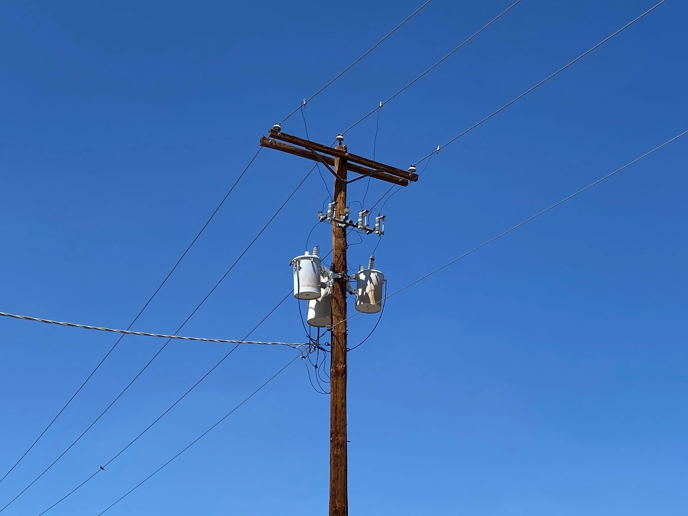 Power transformer at an electrical substation with an on-load tap changer for voltage regulation